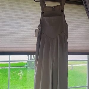 Lightweight, wide leg overalls. (Legs look like a dress). Very cute!